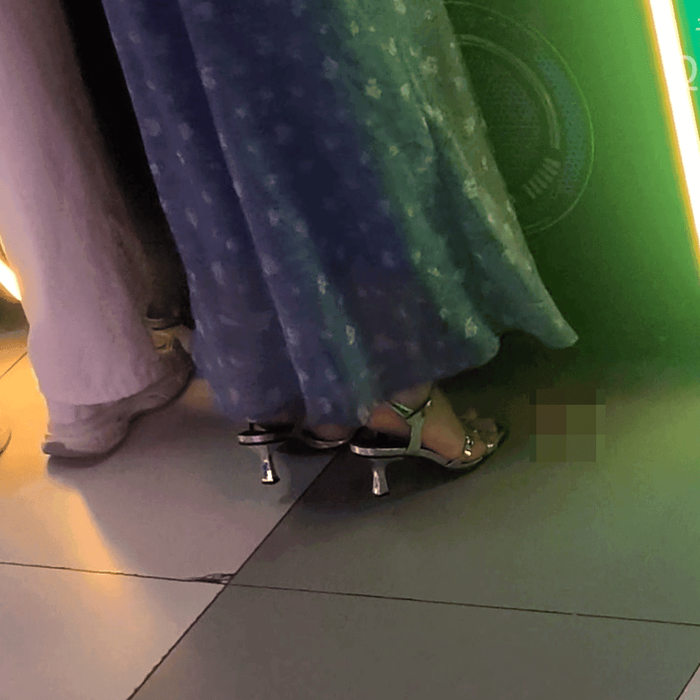 Game arcade woman candid crush with Converse shoes and stiletto heels while playing the basketball shooting machines